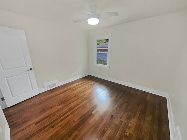 1955 S Columbia Pl, Decatur, GA 30032 - spare room with dark wood finished floors, baseboards, visible vents, and a ceiling fan