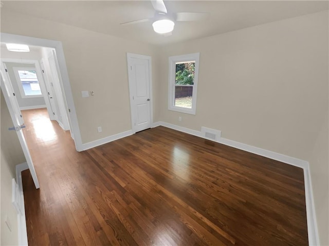 1955 S Columbia Pl, Decatur, GA 30032 - empty room featuring a ceiling fan, dark wood-type flooring, baseboards, and visible vents