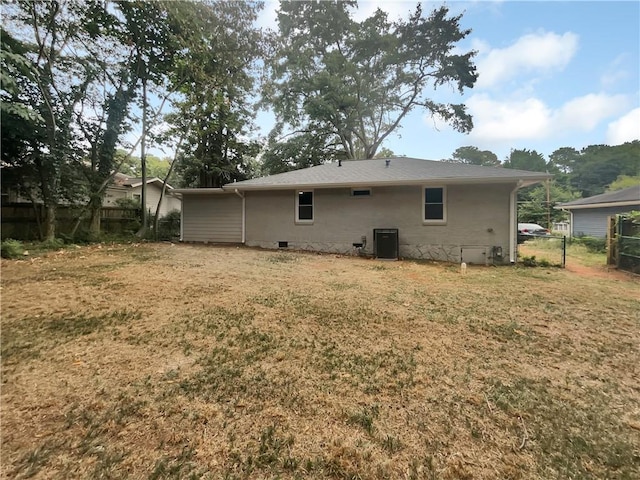 1955 S Columbia Pl, Decatur, GA 30032 - back of house with central air condition unit, a yard, fence, and crawl space