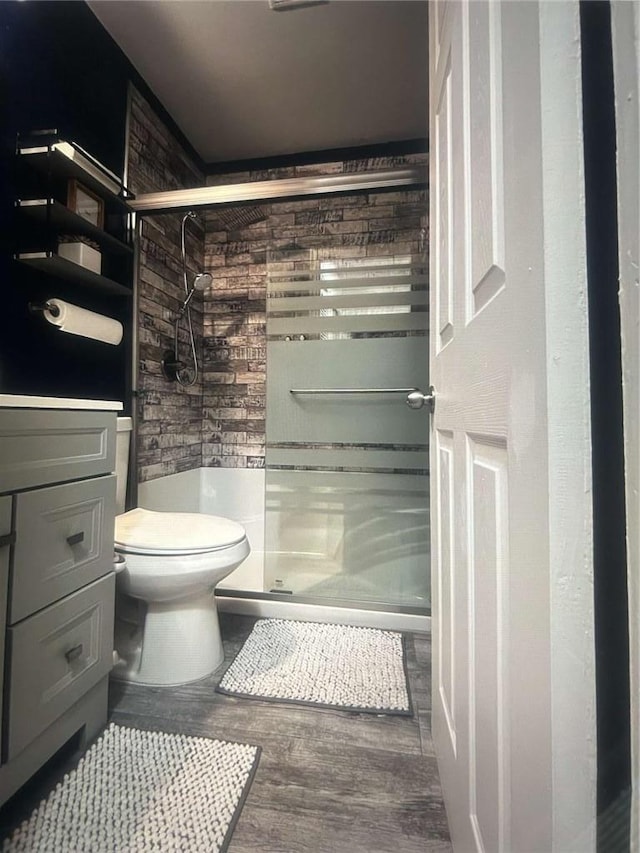1132 SE Oak Knoll Ter SE, Atlanta, GA 30315 - full bath with a shower stall, toilet, wood finished floors, and vanity
