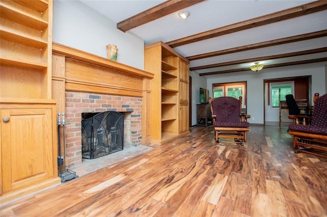 3187 Oak Grove Church Rd, Carrollton, GA 30117 - living area with beam ceiling, wood finished floors, a fireplace, and baseboards