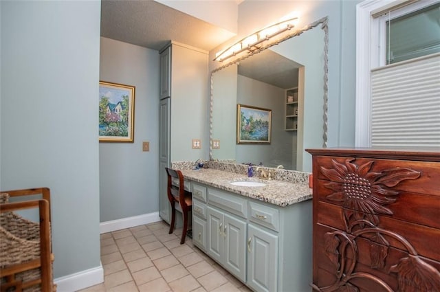3187 Oak Grove Church Rd, Carrollton, GA 30117 - bathroom with vanity, tile patterned floors, and baseboards