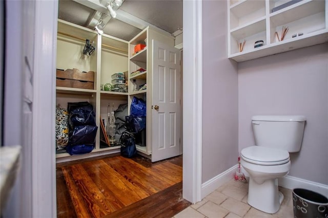 3187 Oak Grove Church Rd, Carrollton, GA 30117 - bathroom featuring toilet, tile patterned floors, and baseboards