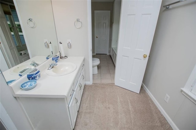 3187 Oak Grove Church Rd, Carrollton, GA 30117 - full bathroom featuring toilet, vanity, baseboards, and a tub to relax in