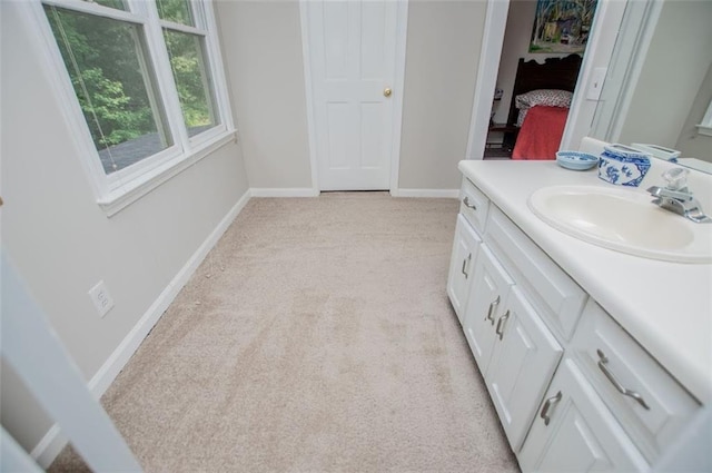 3187 Oak Grove Church Rd, Carrollton, GA 30117 - ensuite bathroom with vanity, baseboards, and carpet