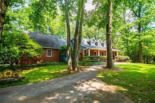 3187 Oak Grove Church Rd, Carrollton, GA 30117 - new england style home featuring brick siding and a front lawn