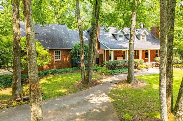 3187 Oak Grove Church Rd, Carrollton, GA 30117 - cape cod house featuring brick siding, a front lawn, and a shingled roof