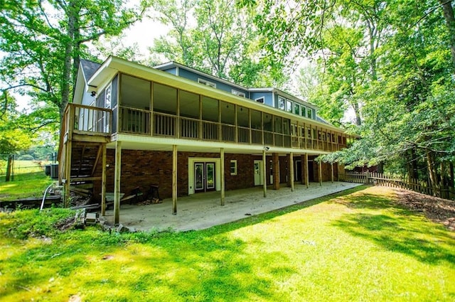 3187 Oak Grove Church Rd, Carrollton, GA 30117 - back of property with a sunroom and a patio