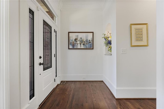 interior space with crown molding and dark wood-type flooring