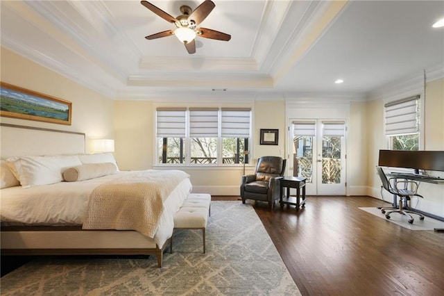 bedroom featuring ornamental molding, dark hardwood / wood-style floors, a raised ceiling, and access to outside