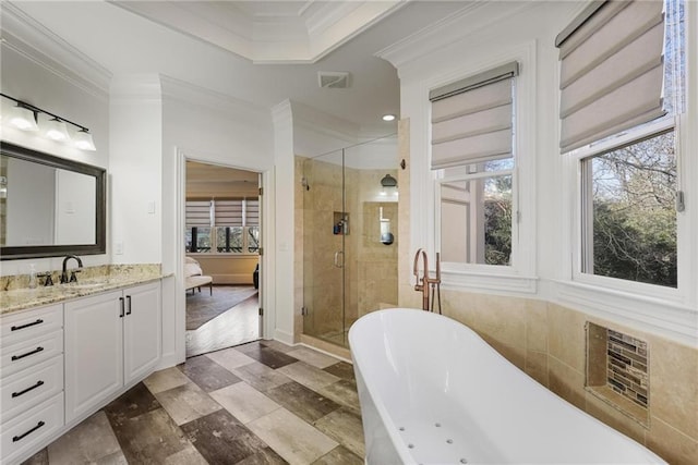 bathroom with vanity, a wall unit AC, ornamental molding, and independent shower and bath