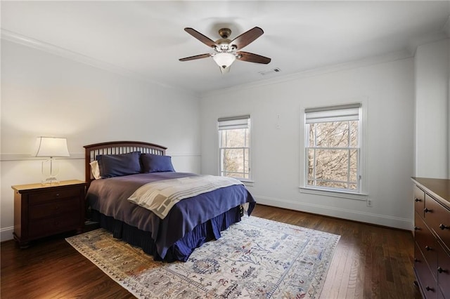 bedroom featuring ceiling fan, ornamental molding, and dark hardwood / wood-style flooring