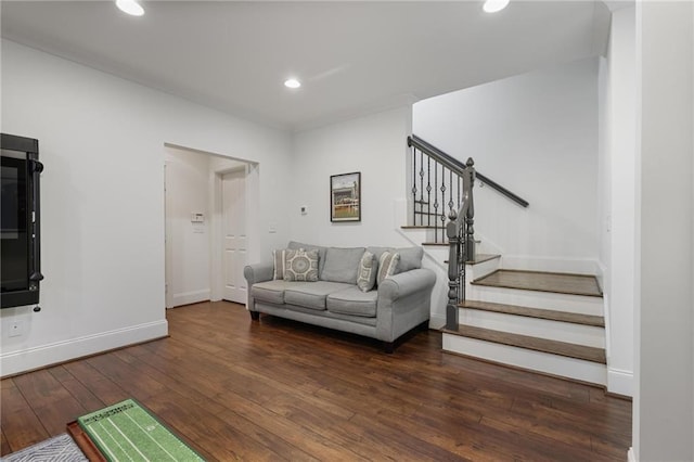 living room with dark hardwood / wood-style flooring