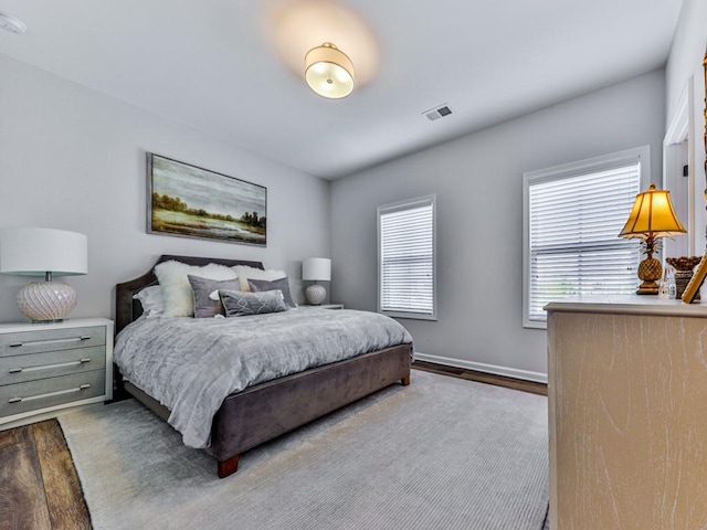 bedroom featuring dark hardwood / wood-style floors