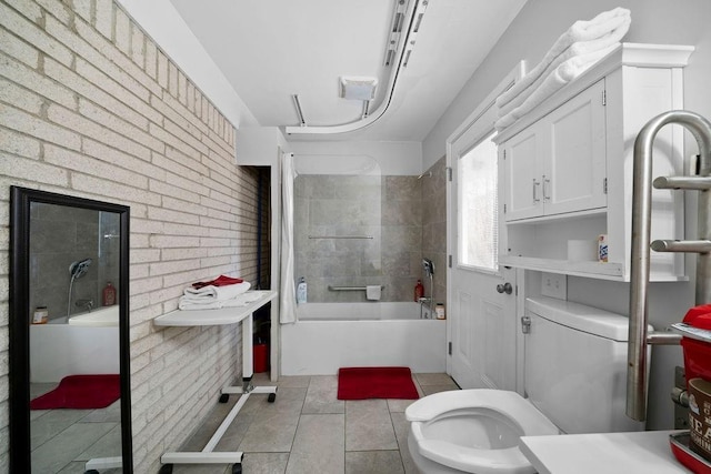 bathroom featuring toilet, tub / shower combination, and tile patterned flooring