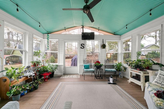 sunroom with ceiling fan and lofted ceiling