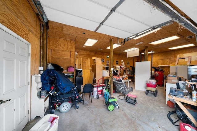 garage featuring wooden walls