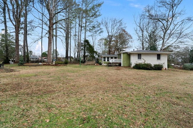 view of yard featuring a wooden deck