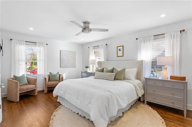 bedroom with recessed lighting, multiple windows, dark wood finished floors, and a ceiling fan