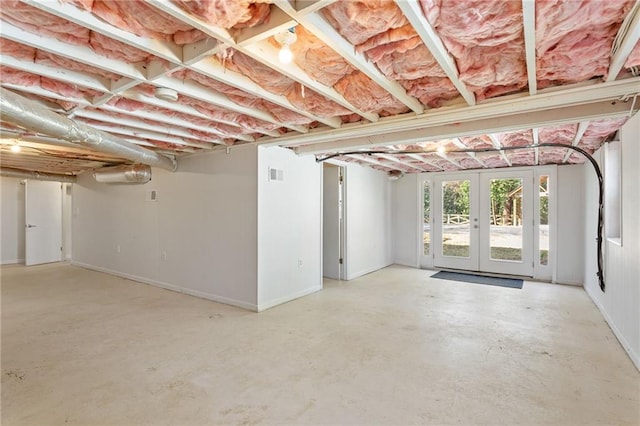 basement with visible vents and french doors