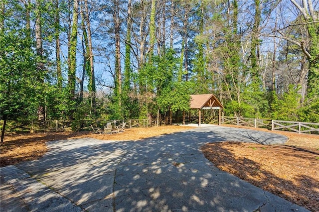 exterior space with a gazebo and fence