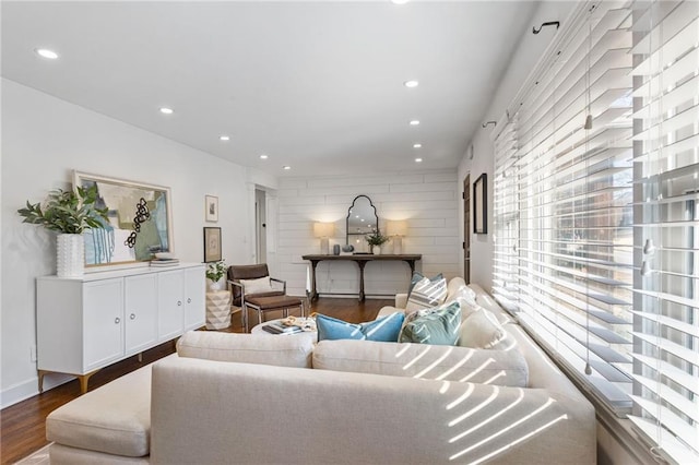 living room featuring recessed lighting, baseboards, and wood finished floors