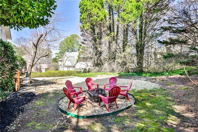 view of yard with a fire pit