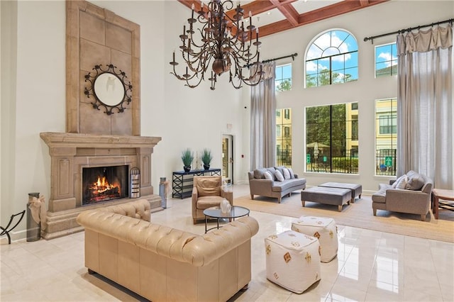 tiled living room featuring a towering ceiling, beamed ceiling, a chandelier, a tiled fireplace, and coffered ceiling