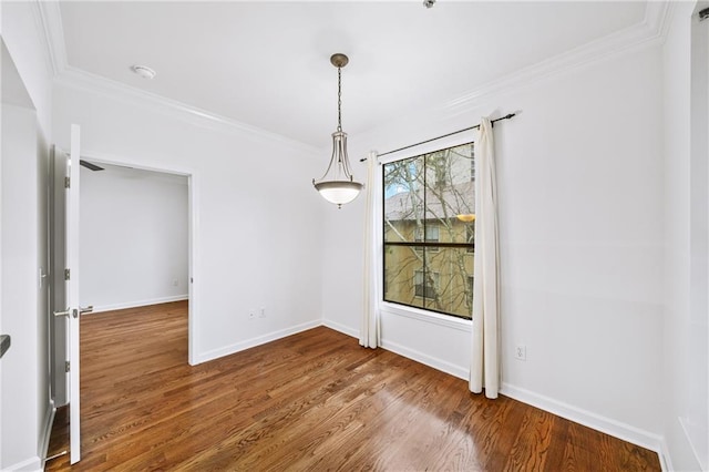 unfurnished dining area with hardwood / wood-style flooring and crown molding