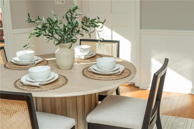 dining area with hardwood / wood-style floors