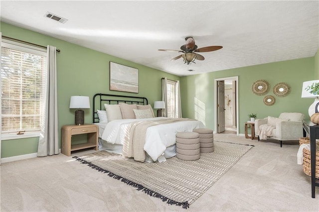 bedroom with light colored carpet and ceiling fan