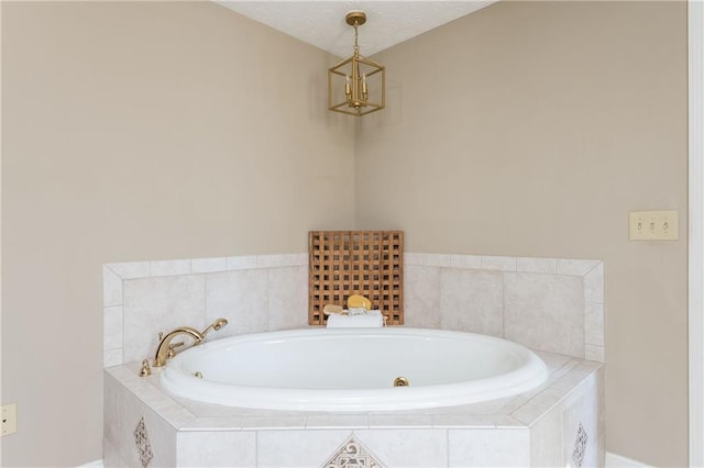 bathroom featuring a relaxing tiled tub and a textured ceiling