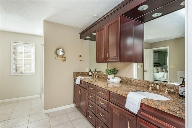 bathroom featuring vanity and tile patterned flooring