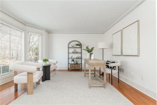 office space featuring ornamental molding and hardwood / wood-style floors