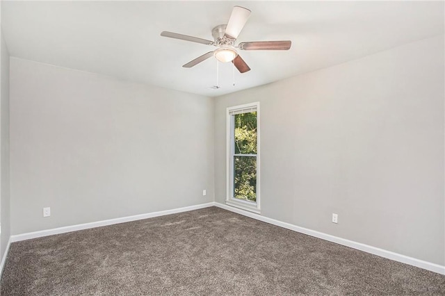 carpeted empty room featuring ceiling fan