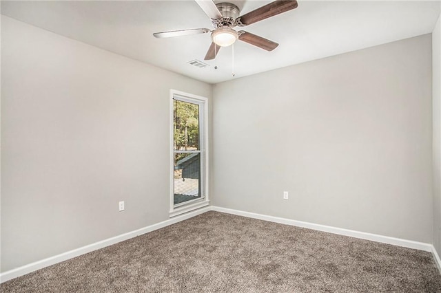 empty room featuring carpet and ceiling fan