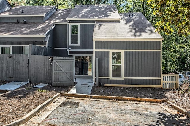 back of property with a patio