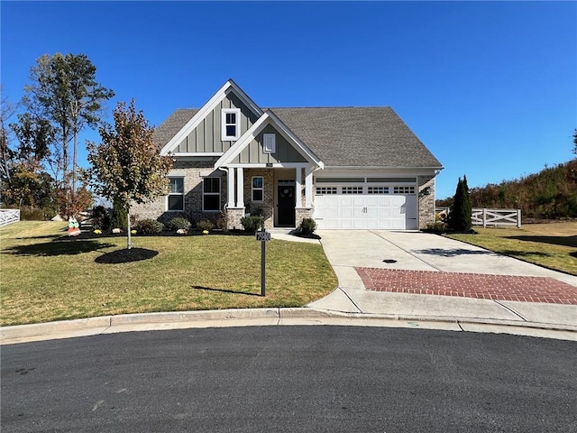 craftsman inspired home with a front yard and a garage