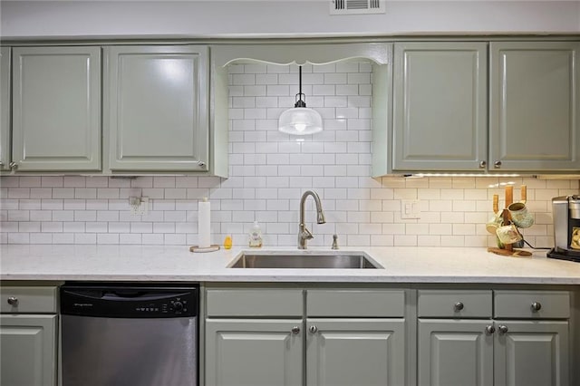 kitchen featuring dishwasher, backsplash, gray cabinets, and sink