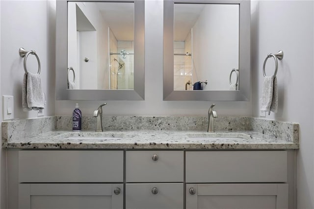 bathroom with vanity and walk in shower