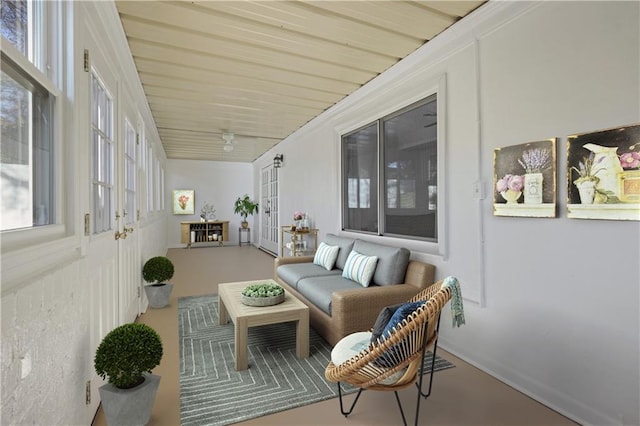 sunroom / solarium featuring vaulted ceiling