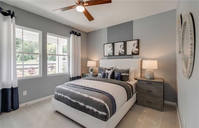 carpeted bedroom featuring ceiling fan