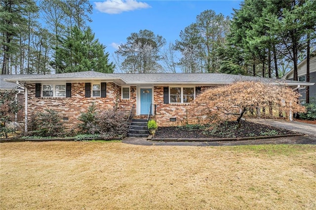 single story home with crawl space, brick siding, a shingled roof, and a front yard