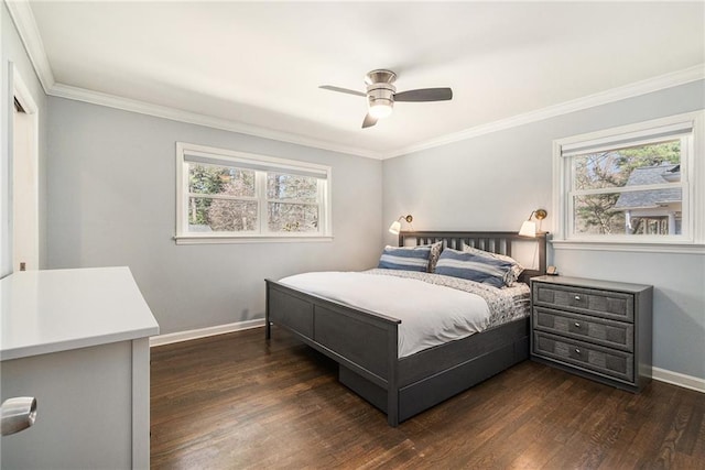 bedroom featuring dark wood-style flooring, crown molding, baseboards, and ceiling fan