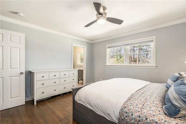 bedroom with ornamental molding, ceiling fan, and dark wood-type flooring