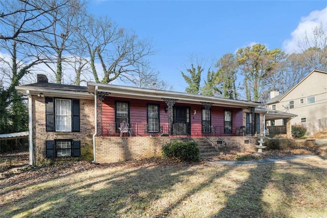 view of front facade with a front lawn and covered porch