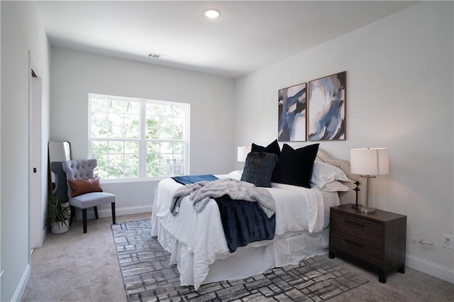 bedroom featuring recessed lighting, baseboards, and light carpet