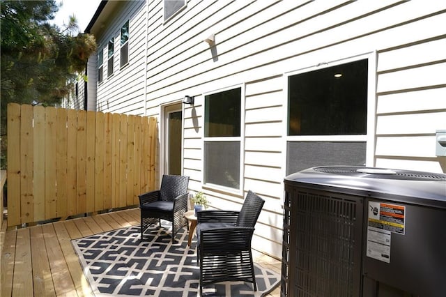 wooden terrace with central AC and fence