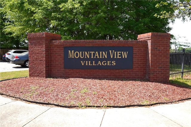 community sign with fence