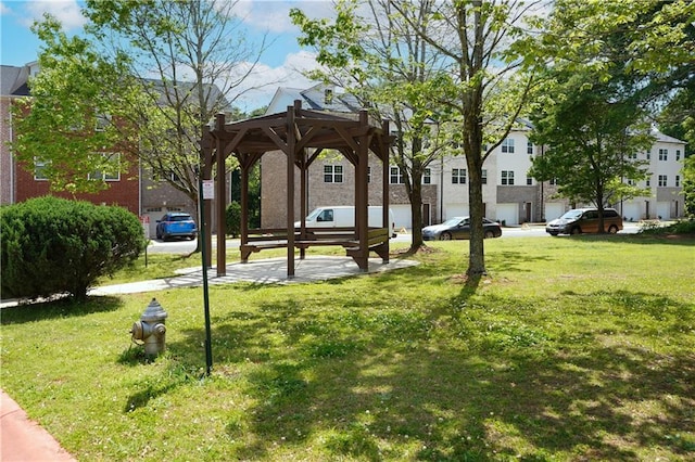 surrounding community with a lawn and a residential view
